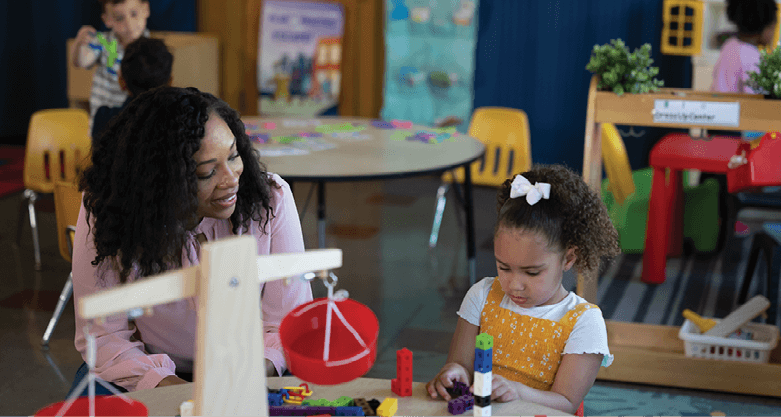 Teacher with young child