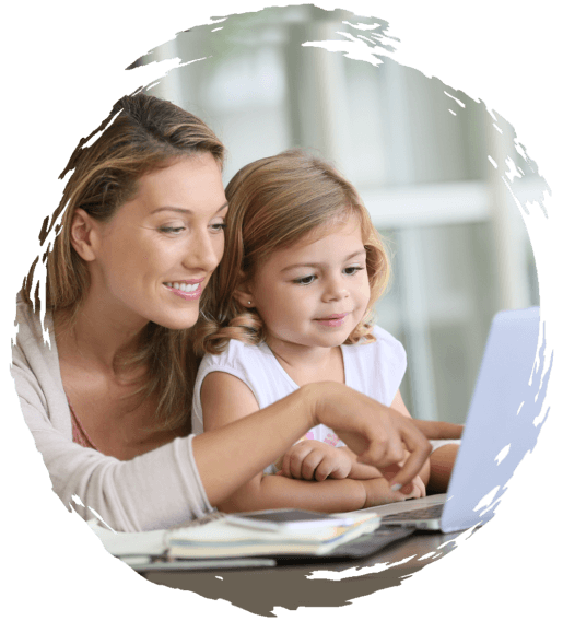 Parent helping young child with online learning